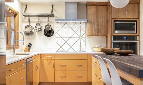 Statement orange cabinets in kitchen design