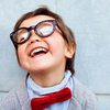 young boy with thick rimmed glasses