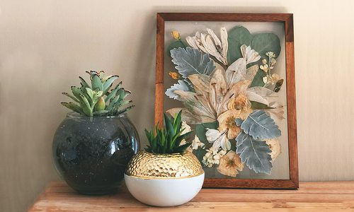 Pressed wedding bouquet in a wooden photo frame