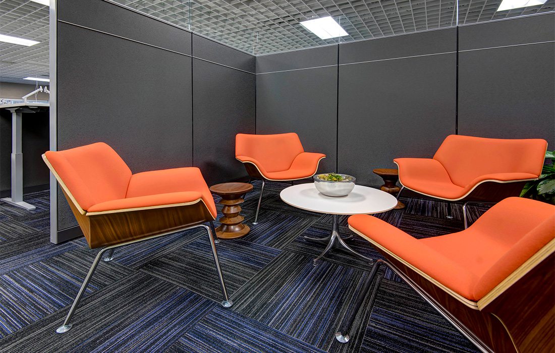 Orange chairs in office cubicle