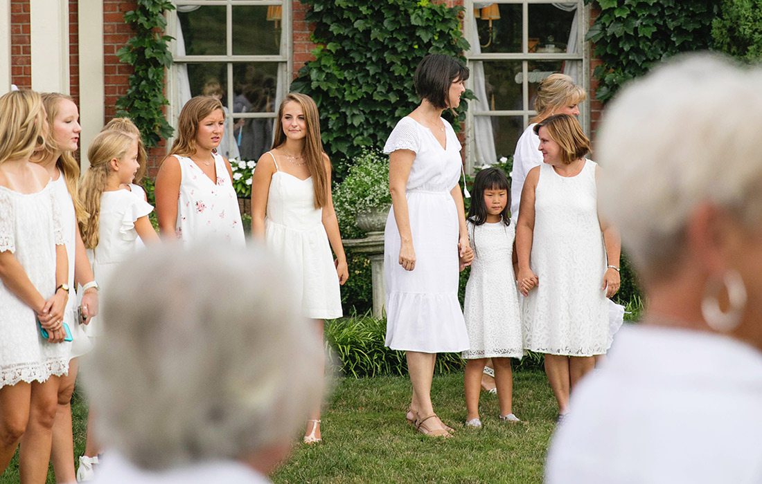 Family and friends gathered outside at a bridal shower