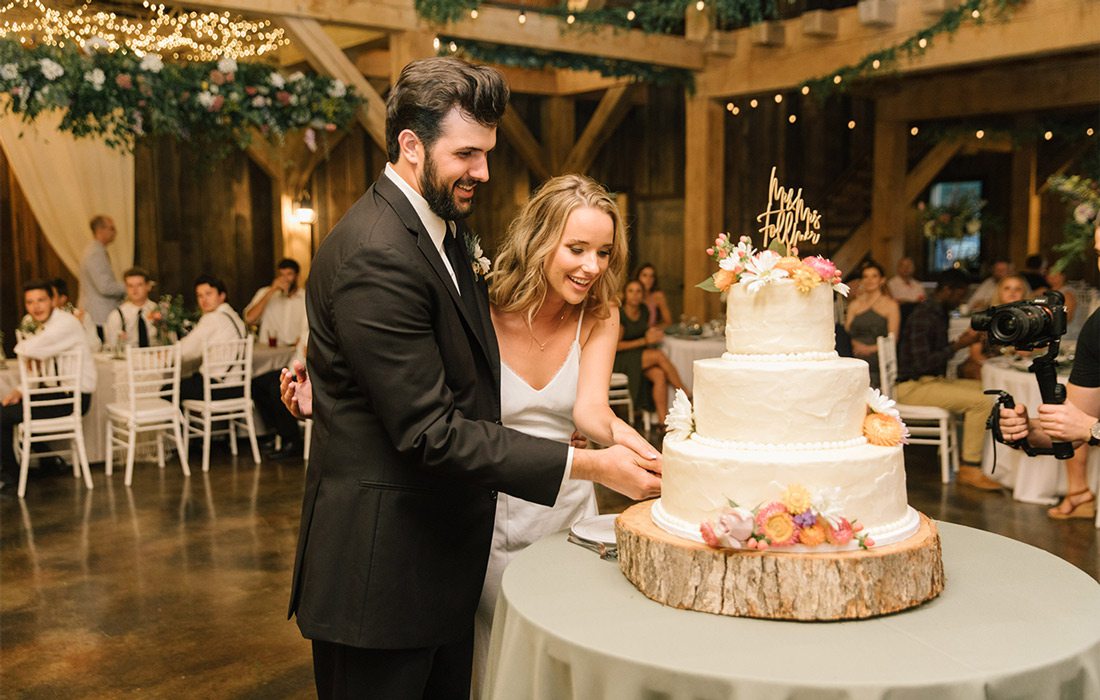 Ray Bierman & Danny Follmer cutting wedding cake