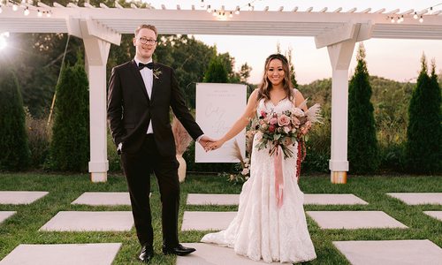 Regan King & Cindy Chao on their wedding day at Greenhouse Two Rivers in Highlandville MO