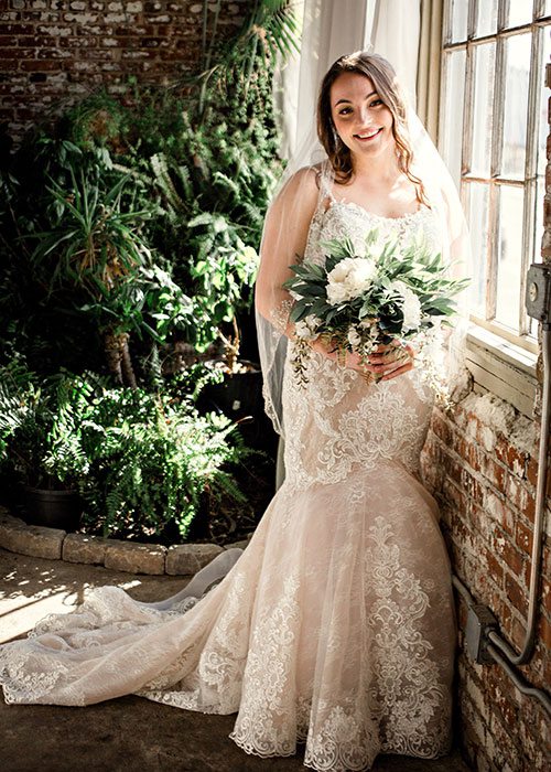 Bride Ali Suman on her wedding day at Venue on Brick in Ozark MO