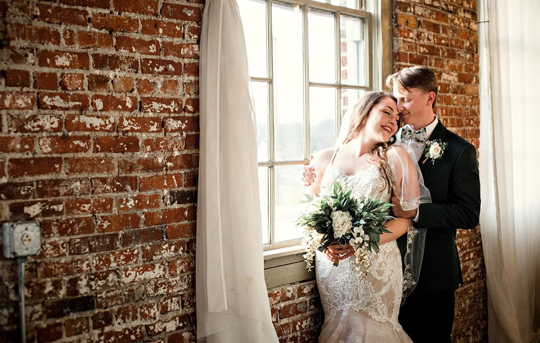 Ali Suman & Rick Peery on their wedding day at Venue on Brick in Ozark MO