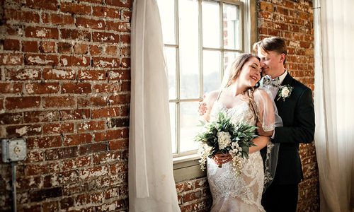 Ali Suman & Rick Peery on their wedding day at Venue on Brick in Ozark MO