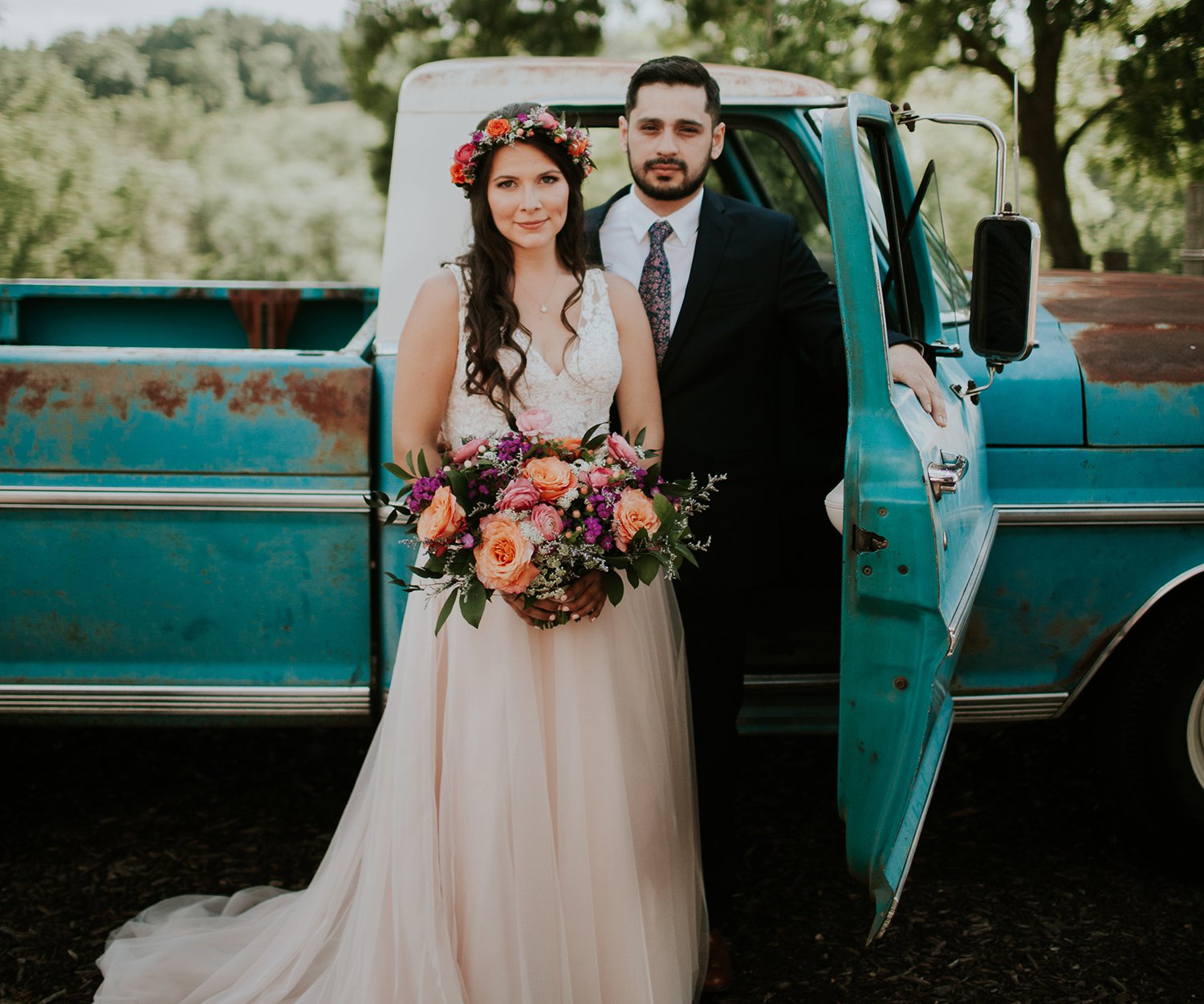 Mackenzie Lee & Ricky Hernandez wedding portrait with an old pickup truck