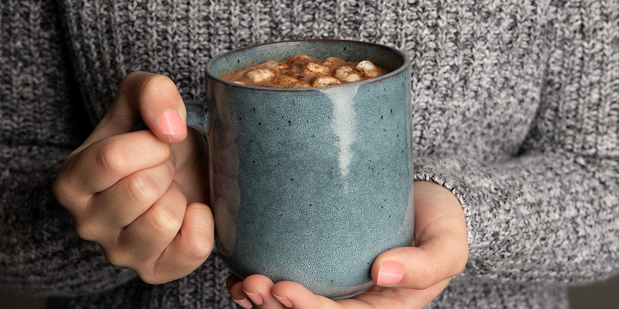 Woman holding a mug of hot cocoa