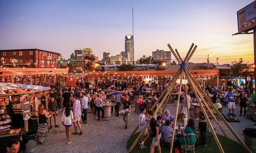 outdoor food court with a sunset