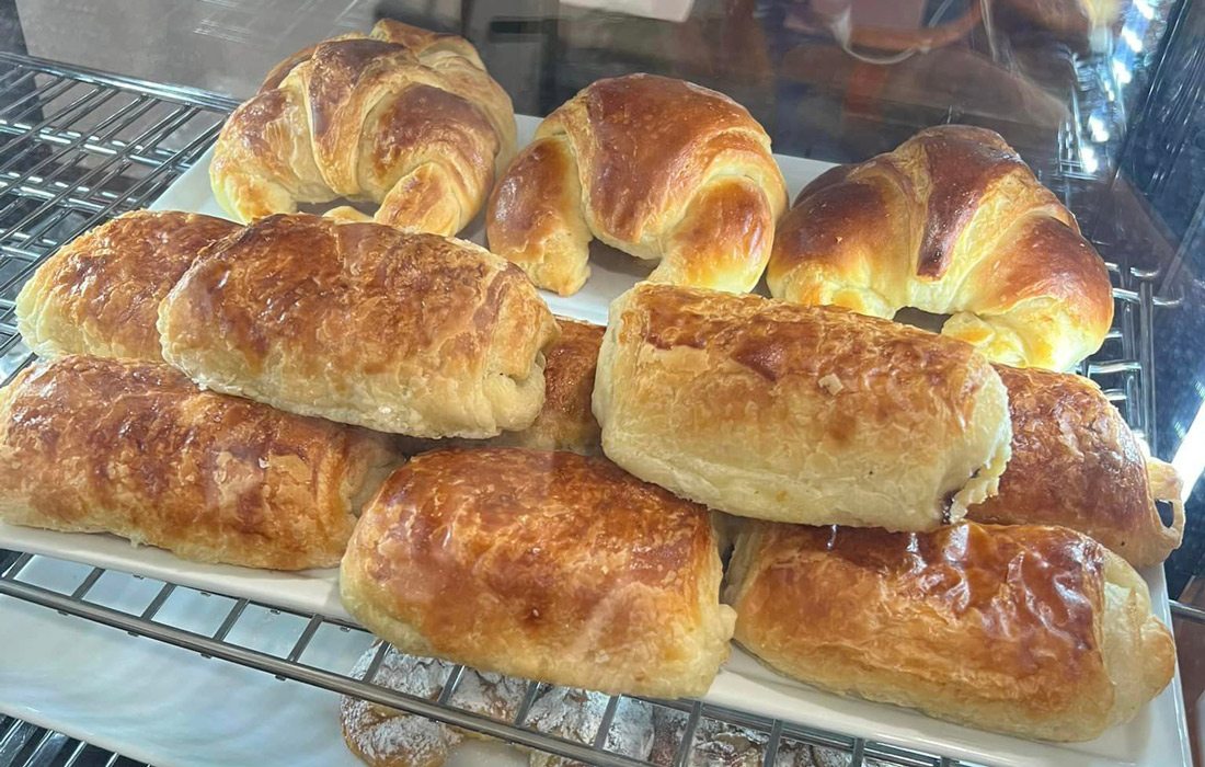 Pastries in a glass case.