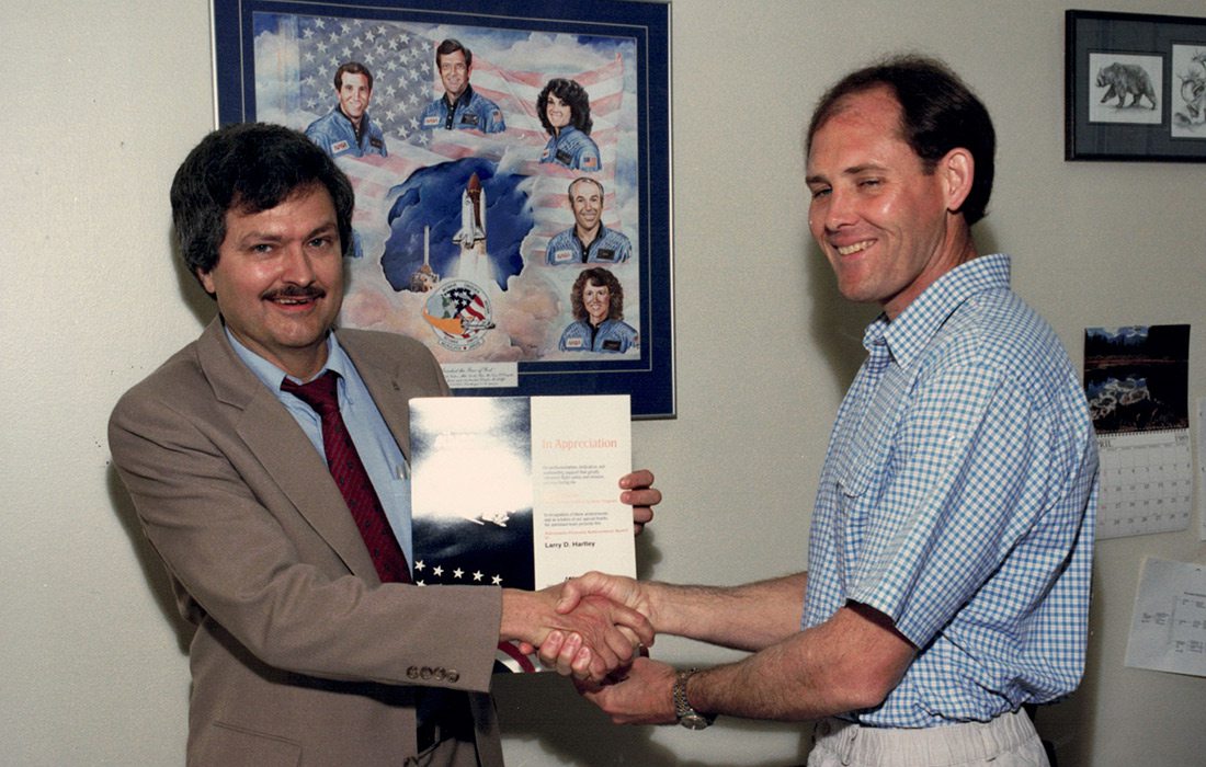 Larry Hartley receiving an award from NASA