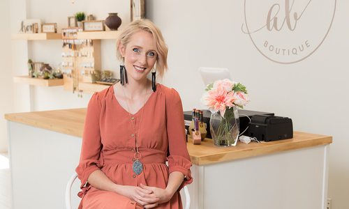 young woman in bright boutique