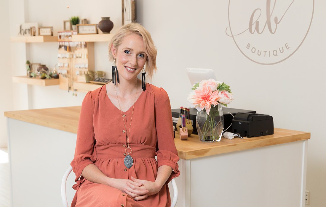 young woman in bright boutique