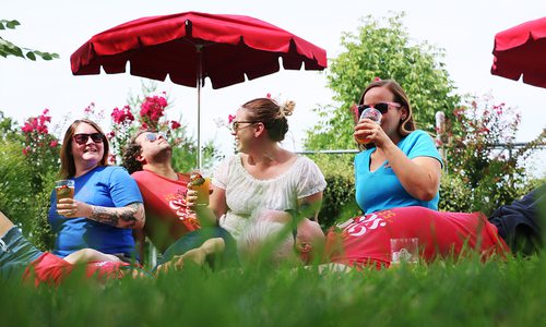 People enjoying beers in the Mother's Brewing Company backyard in Springfield MO