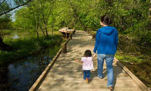 Mother and child on a trail at the Springfield Conservation Nature Center