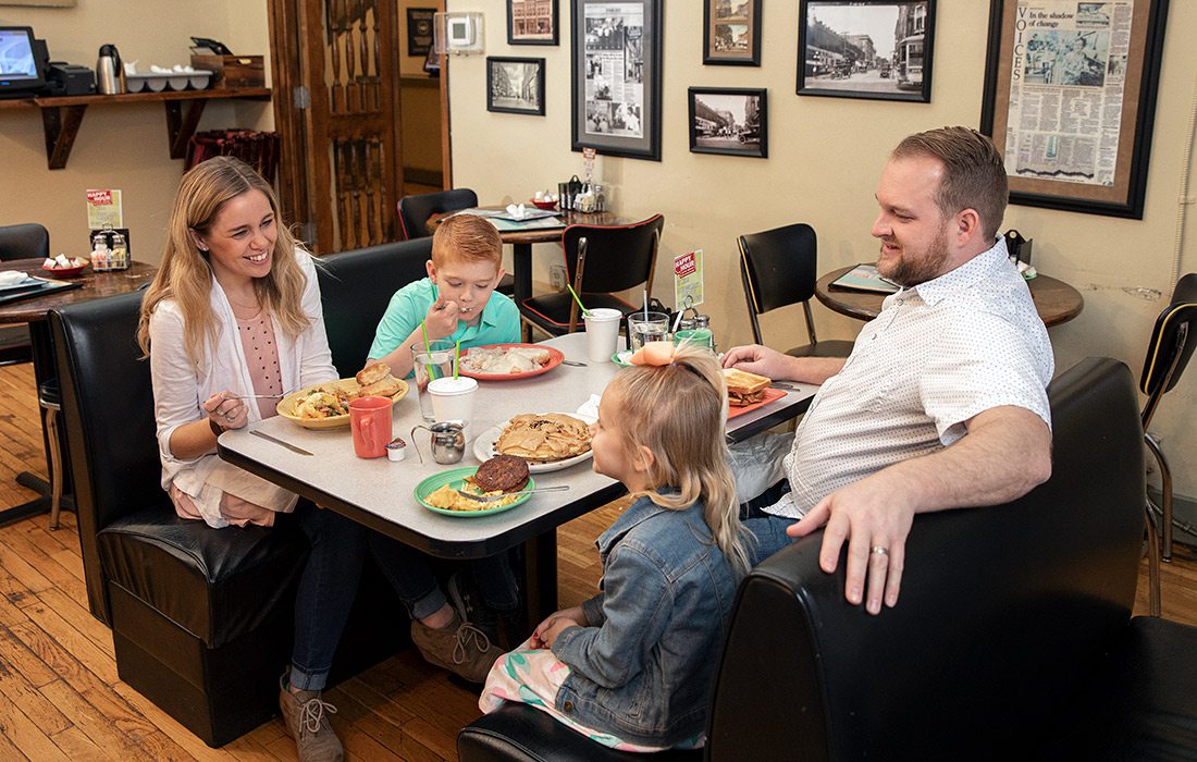 Young family eating breakfast at Gailey's in downtown Springfield MO