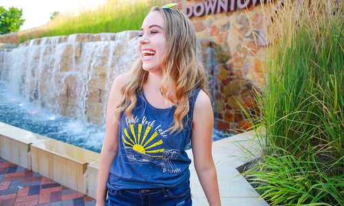 young girl modeling a t-shirt