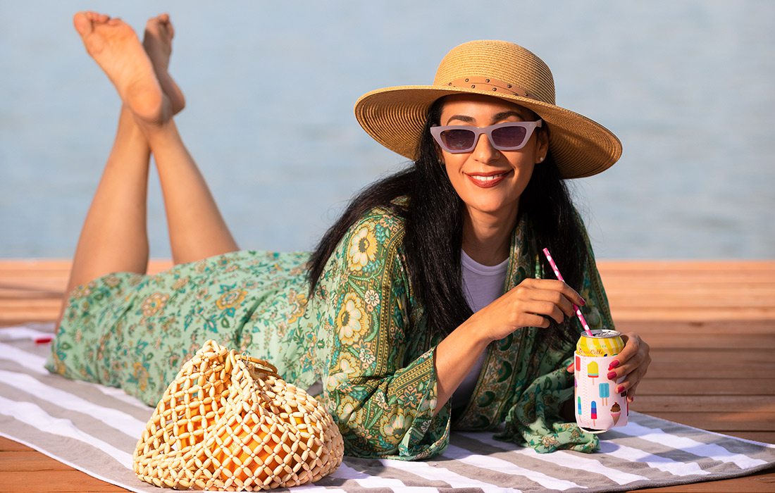 Summer style model laying down by the lake