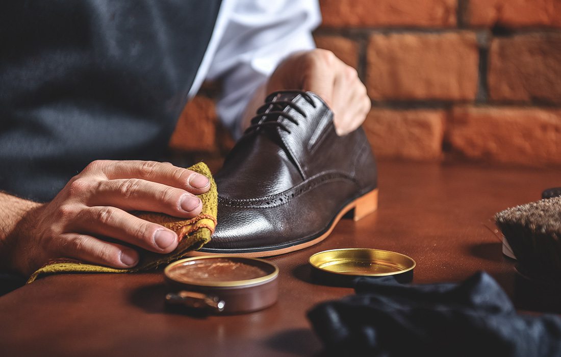 man shining a shoe