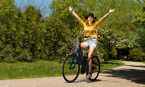 Jessica Pearson riding a bike through Nathanael Greene/Close Memorial Park in Springfield MO