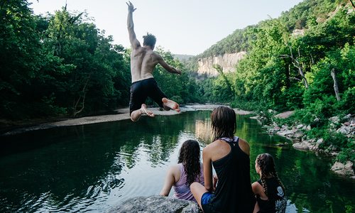 cliff jumping into water