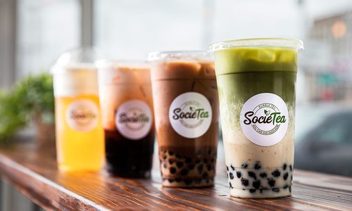 Drinks of different color and content sit lined up on the SocieTea counter.