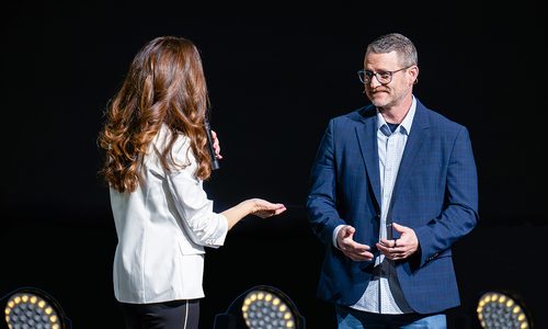Logan Aguirre and Tom Douglas on stage at 2025 Think Summit event.