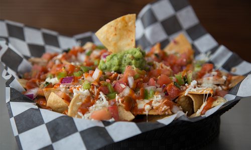 chicken nachos in a basket