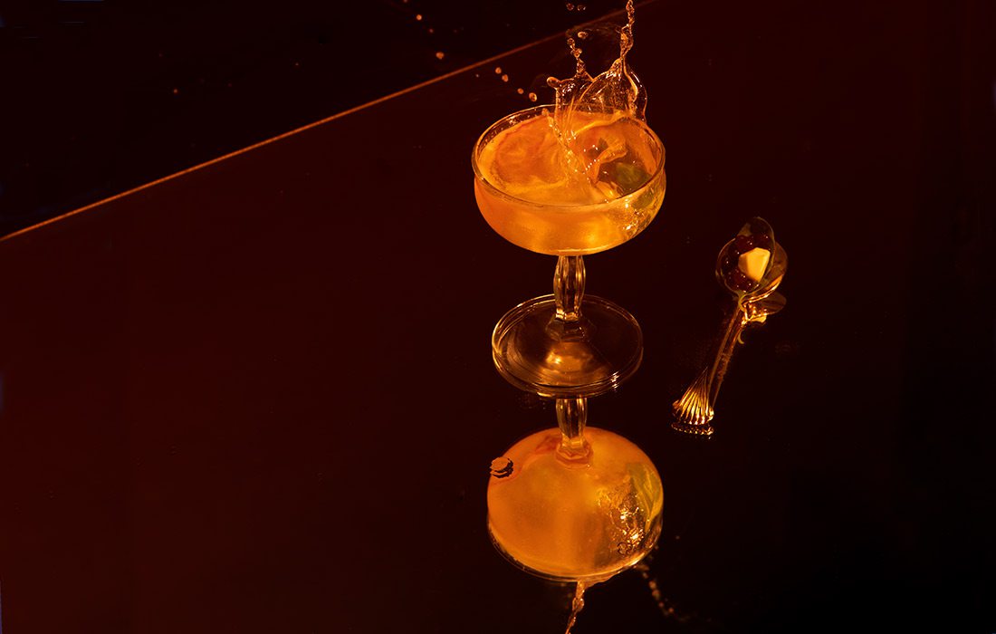 Tomato water with droplets on mirror surface