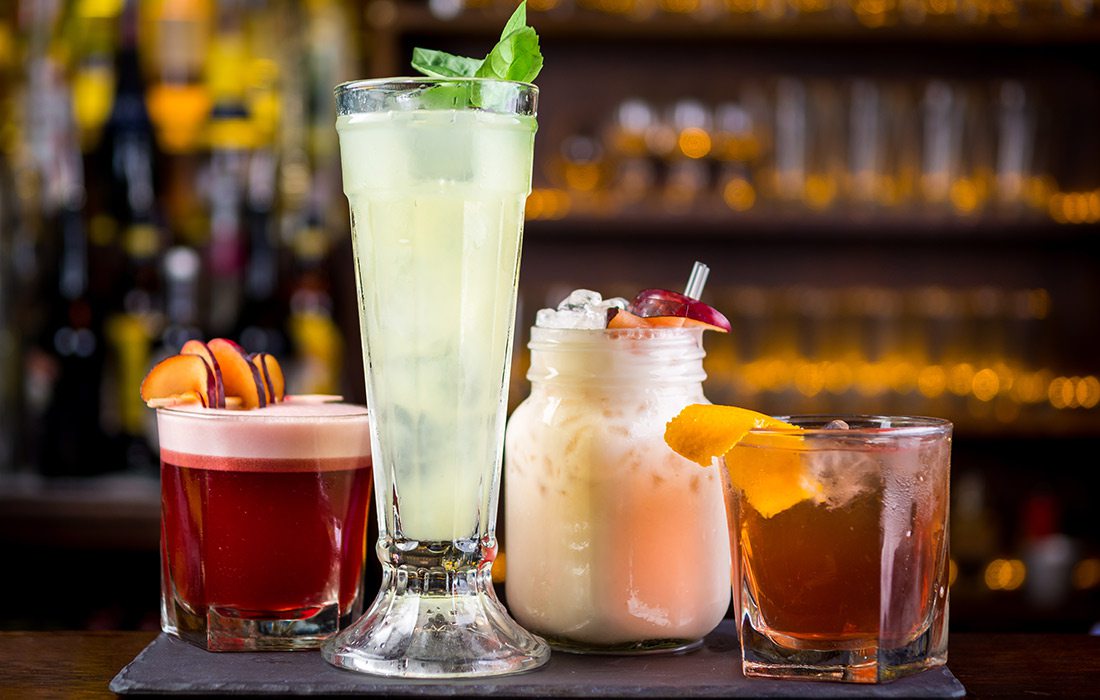 various cocktails and mocktails on a bar