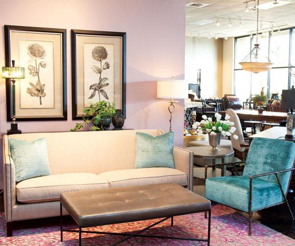 White couch and blue chair in home decor store.