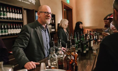 People drinking whiskey together