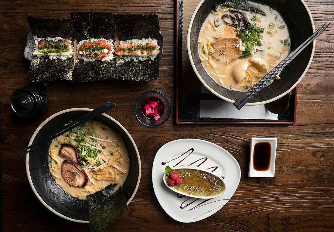 Beautiful ramen and sushi on wood table with soy sauce.