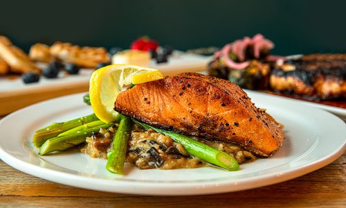 Salmon filet with mushroom and red pepper risotto