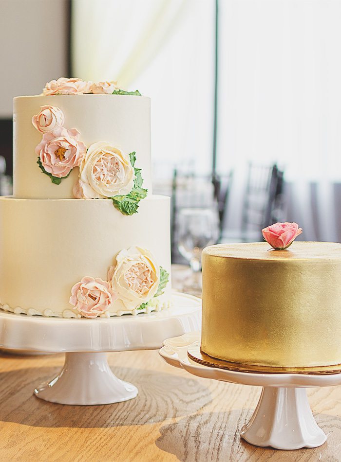 a white and a gold wedding cake