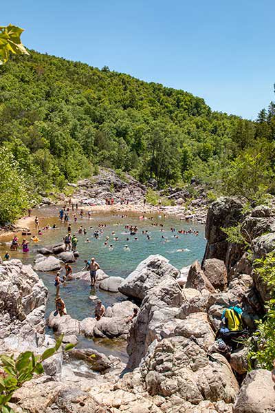 large group enjoys one of the largest swimming holes