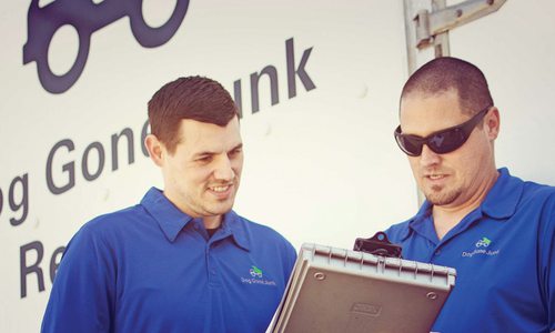 Workers looking at clipboard