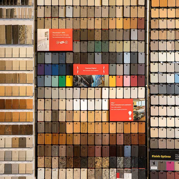 slabs of materials of different colors, textures, and type line the wall