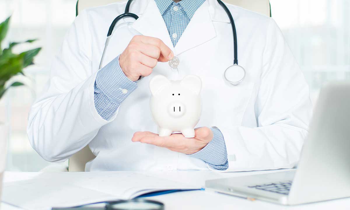 a doctor drops a coin into a piggy bank