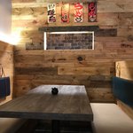 Slider Thumbnail: Restaurant booth with wood table