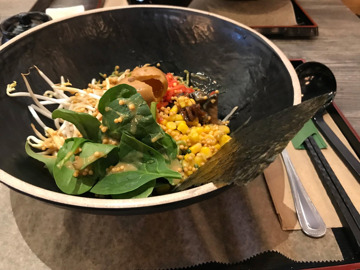 Healthy ramen with spinach, mushrooms, seaweed and sprouts.