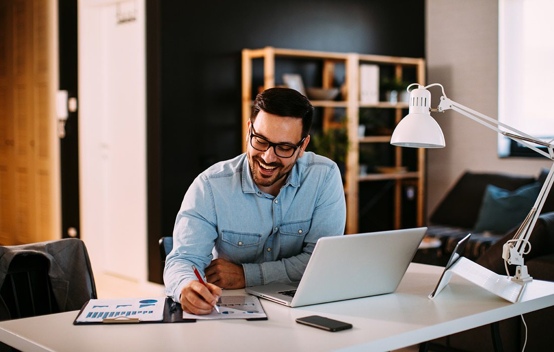 Man works on computer at desk