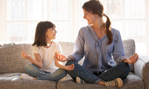 Girl and mother meditating