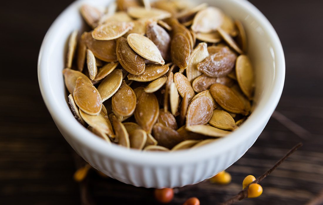 Roasted pumpkin seeds stock photo.