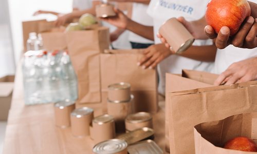 Volunteers bagging up food