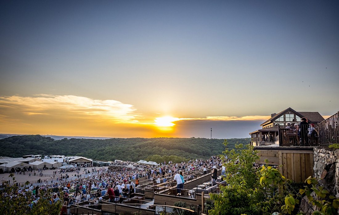 The terrace tables at Thunder Ridge Nature Arena offer a relaxing place for guests to enjoy the show.