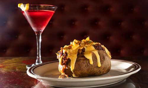 The Hot Mess baked potato topped with pulled bork and macaroni and cheese from The Collective Eatery