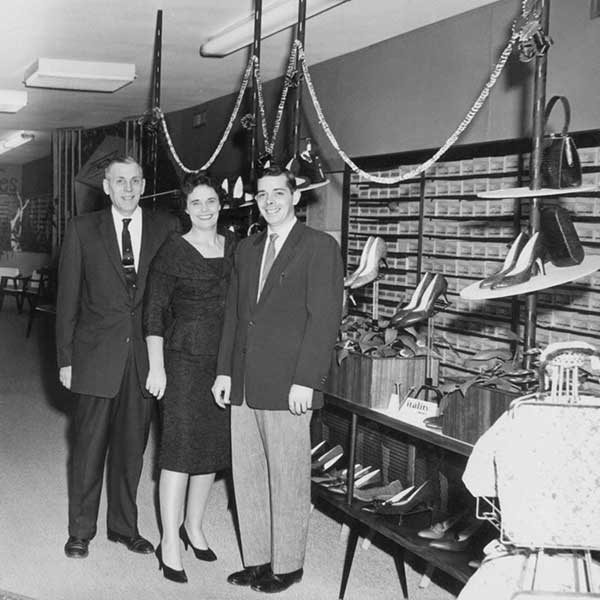 the original store owners smiling in the very beginnings of the store