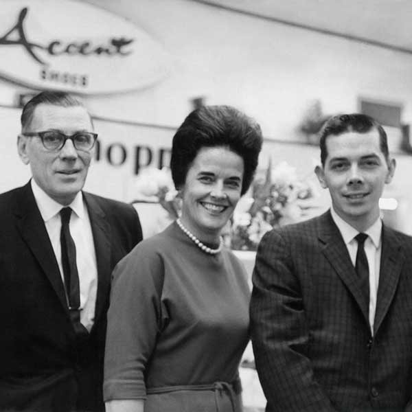 the original store owners smiling in the very beginnings of the store