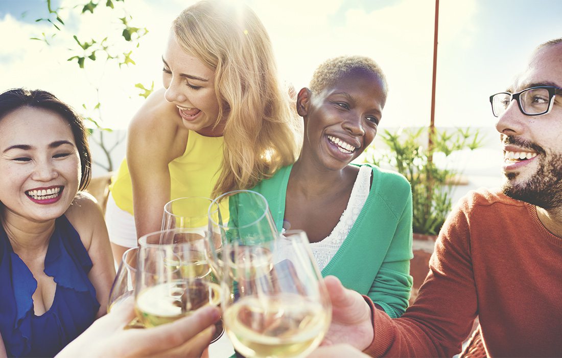 Friends enjoying a glass of wine.